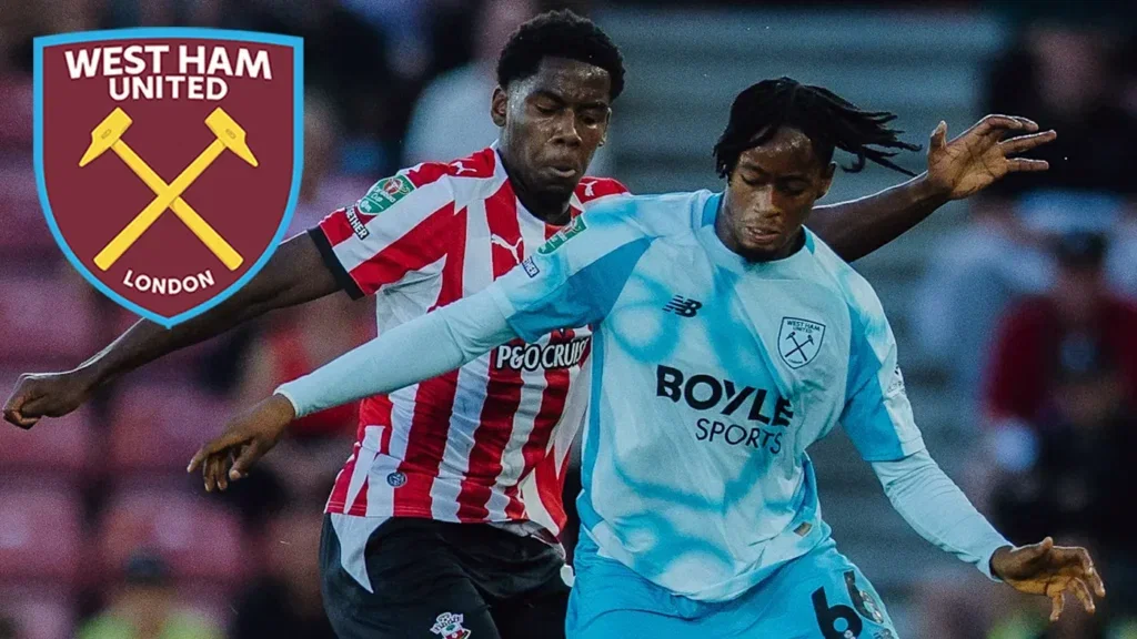 Ajala holds off a Southampton defender after scoring for West Ham