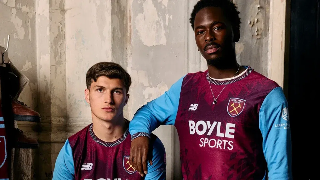 Freddie Potts and Soungoutou Magassa modelling West Ham United's 2026-27 New Balance home shirt